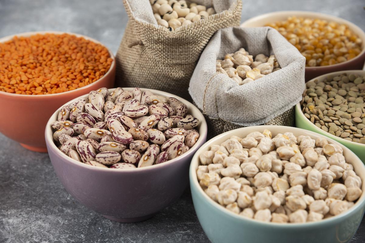 different-type-of-raw-dry-legumes-composition-on-marble-table-surface