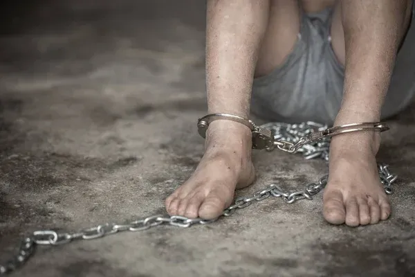 depositphotos_252679368-stock-photo-children-with-chain-tied-imprison