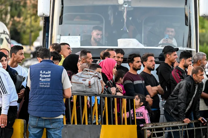 AFP__20240925__36H68QA__v2__HighRes__HundredsCrossedIntoSyriaFromLebanonAfterIsraelS