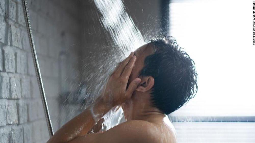 cnne-1207363-handsome-asian-guy-taking-a-shower-in-the-bathroom