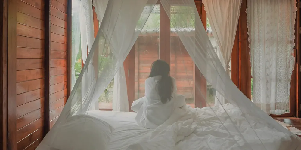woman-mosquito-net-1200x600